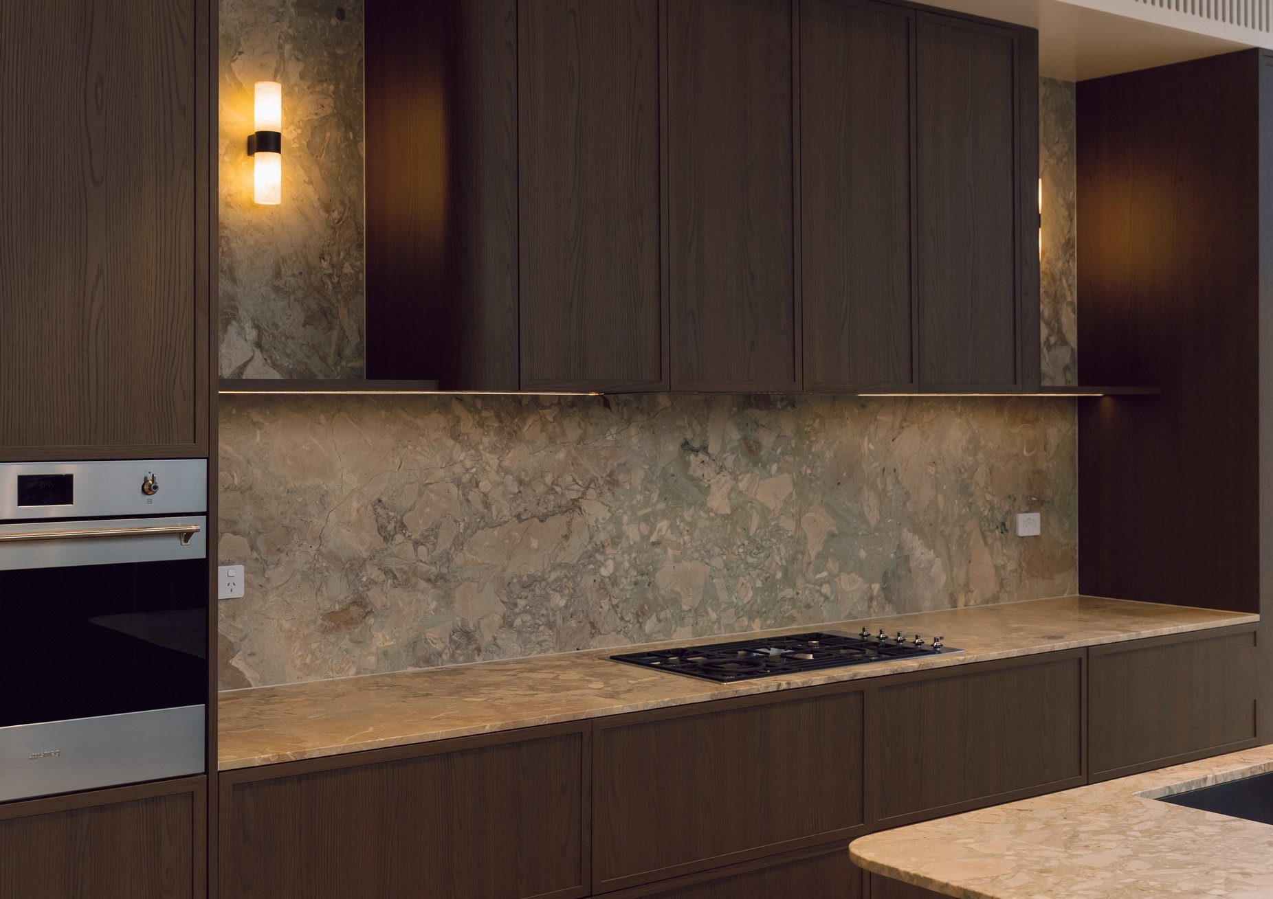 Walnut kitchen with natural stone